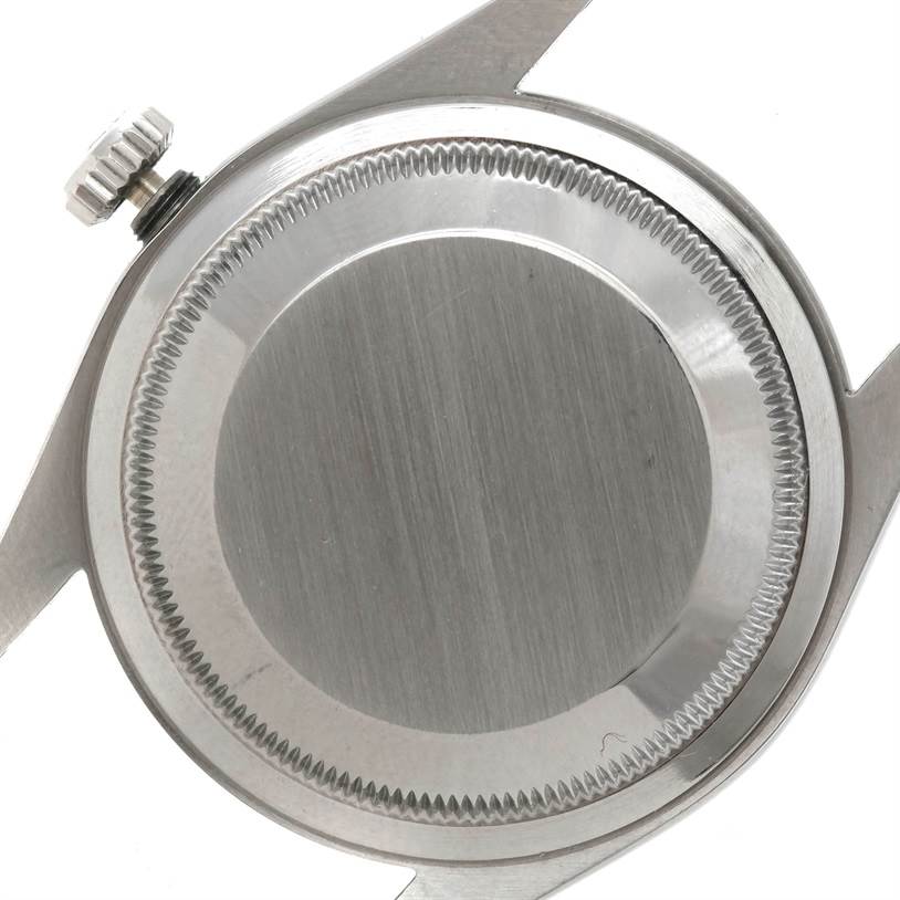 This image shows the case back and part of the crown of a Rolex Explorer 14270 Men's Stainless Steel Black Dial 14270 Men's Stainless Steel Black Dial watch.