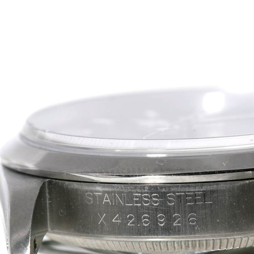 The image shows a close-up side angle of the stainless steel case and serial number of the Rolex Explorer 14270 Men's Stainless Steel Black Dial 14270 Men's Stainless Steel Black Dial watch.