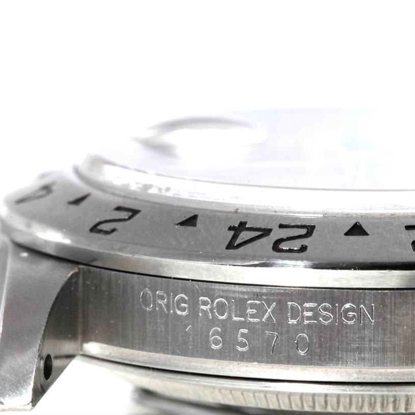 The image shows a close-up side view of the bezel and case of the Rolex Explorer 16570 Men's Stainless Steel Black Dial 16570 Men's Stainless Steel Black Dial watch, highlighting the model number and design engraving.