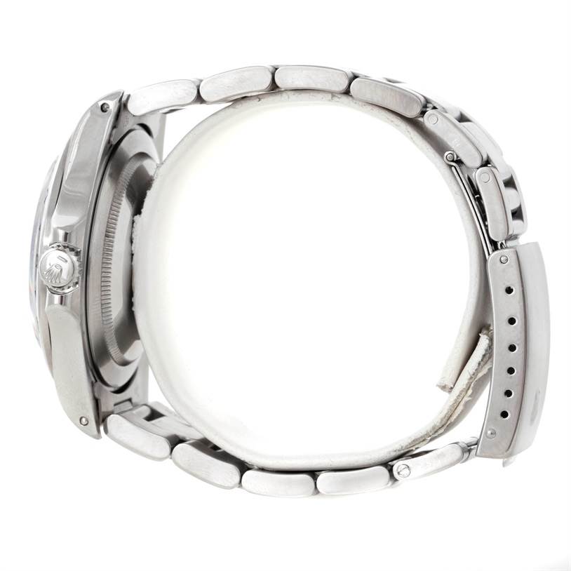 The image shows a side view of a Rolex Explorer 16570 Men's Stainless Steel Black Dial 16570 Men's Stainless Steel Black Dial watch, highlighting the case, crown, and bracelet.