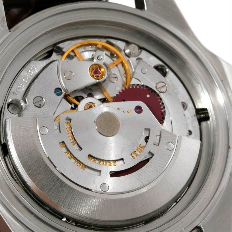 The image shows the movement and internal mechanisms of a Rolex Explorer 16550 Men's Stainless Steel White Dial 16550 Men's Stainless Steel White Dial watch from a close-up, revealing its intricate parts.