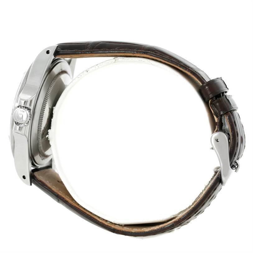 A side view of the Rolex Explorer 16550 Men's Stainless Steel White Dial 16550 Men's Stainless Steel White Dial watch showing its case, crown, and brown leather strap with clasp.