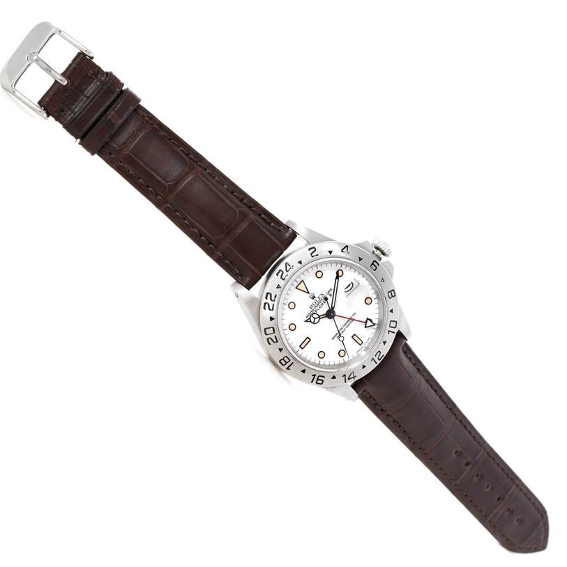 The Rolex Explorer 16550 Men's Stainless Steel White Dial 16550 Men's Stainless Steel White Dial watch is shown at a slightly tilted angle, displaying its face, bezel, crown, and brown leather strap.