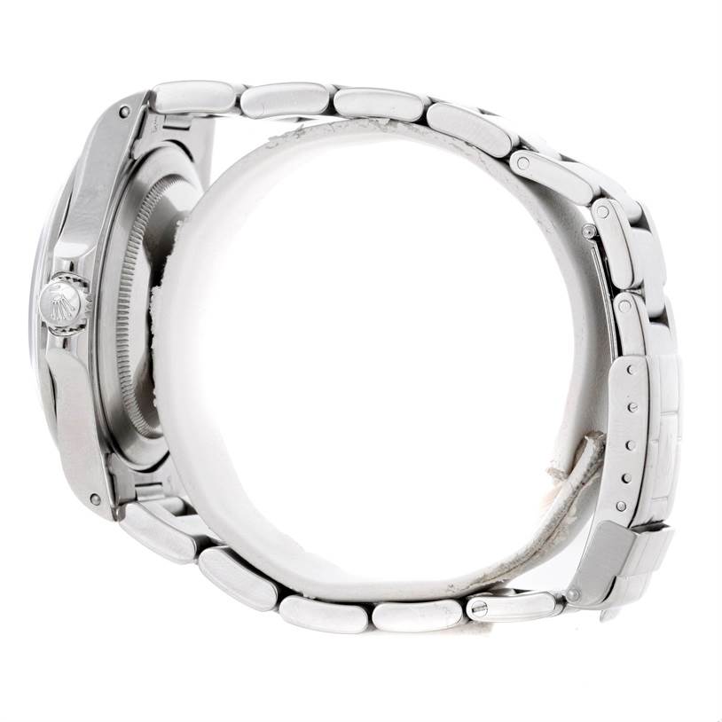 The image shows a side view of the Rolex Explorer 16570 Men's Stainless Steel White Dial 16570 Men's Stainless Steel White Dial, highlighting the crown and bracelet links.