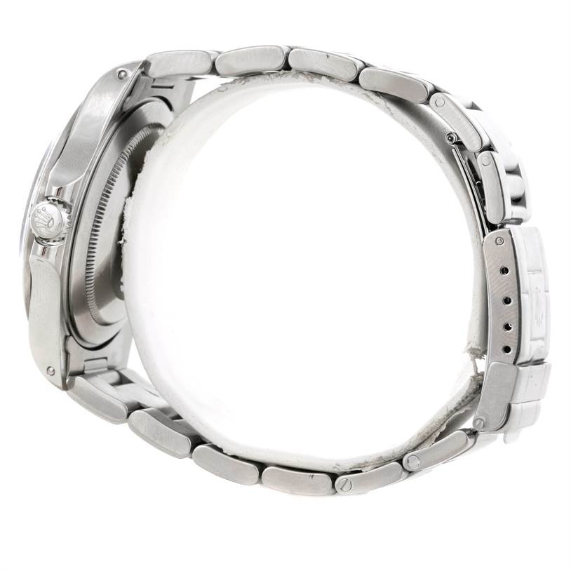 The image shows a side view of the Rolex Explorer 16570 Men's Stainless Steel White Dial 16570 Men's Stainless Steel White Dial watch, highlighting its metal bracelet and partially visible crown.