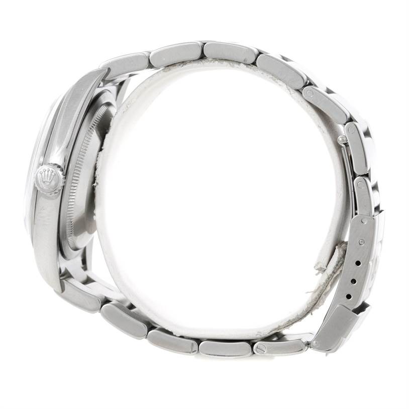 This image shows a side view of the Rolex Explorer 114270 Men's Stainless Steel Black Dial 114270 Men's Stainless Steel Black Dial watch, highlighting the crown, case, and bracelet.