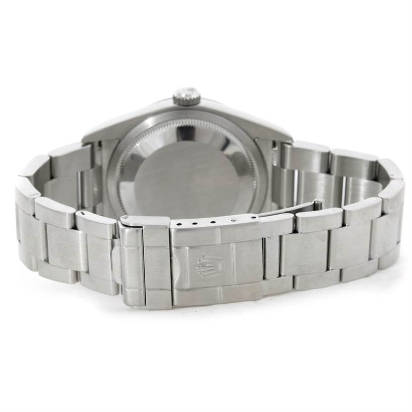 The image shows the back view of a Rolex Explorer 114270 Men's Stainless Steel Black Dial 114270 Men's Stainless Steel Black Dial watch, highlighting its case back and stainless steel bracelet.