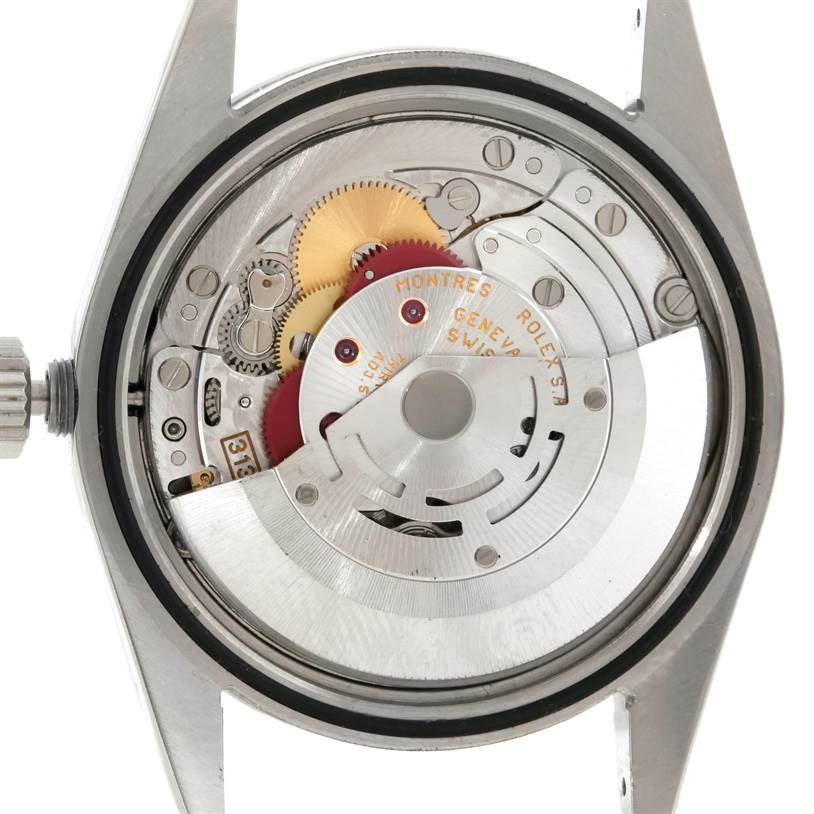The image shows the inner mechanical movement of a Rolex Explorer 114270 Men's Stainless Steel Black Dial 114270 Men's Stainless Steel Black Dial watch with its back case removed.