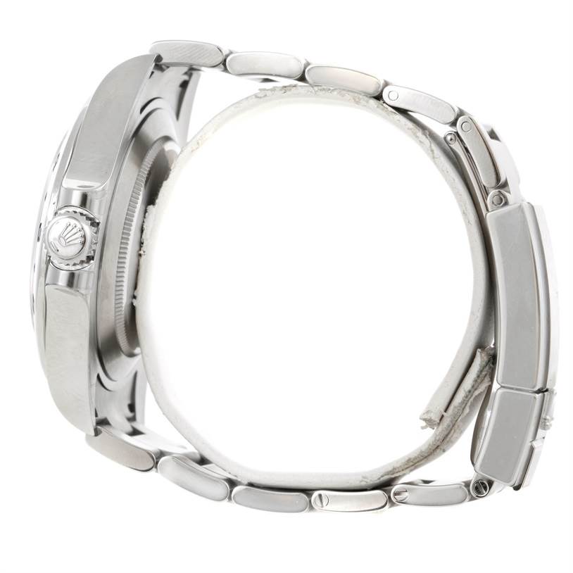 The image shows a side view of the Rolex Explorer 216570 Men
s Stainless Steel Black Dial 216570 Men
s Stainless Steel Black Dial watch, highlighting its crown, case, and bracelet links.