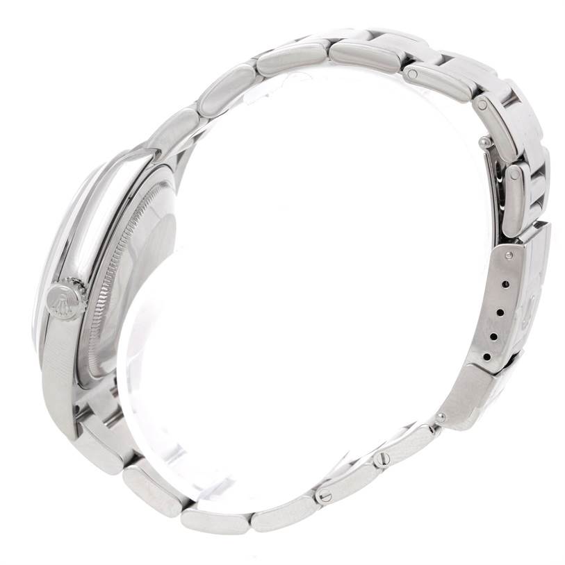 The image shows a side view of a Rolex Explorer 114270 Men's Stainless Steel Black Dial 114270 Men's Stainless Steel Black Dial watch, highlighting its crown, case, and bracelet.