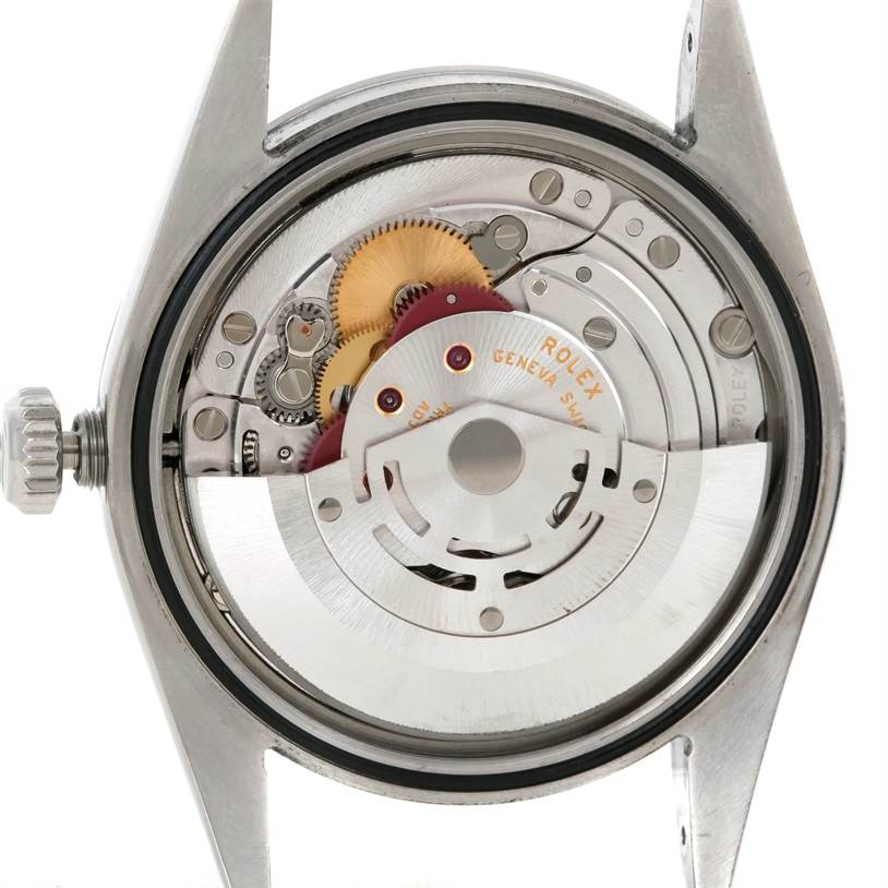 This image shows the back view of a Rolex Explorer 114270 Men's Stainless Steel Black Dial 114270 Men's Stainless Steel Black Dial model watch, revealing its internal mechanical movement.