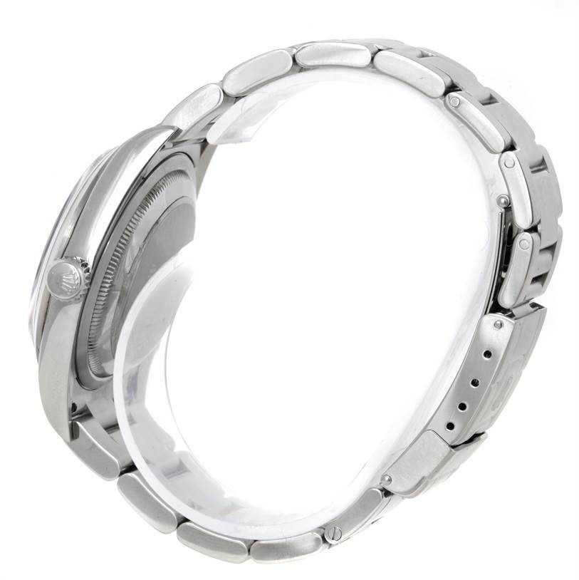 The image shows a side view of a Rolex Explorer 114270 Men's Stainless Steel Black Dial 114270 Men's Stainless Steel Black Dial watch, highlighting the crown, case, and part of the bracelet.