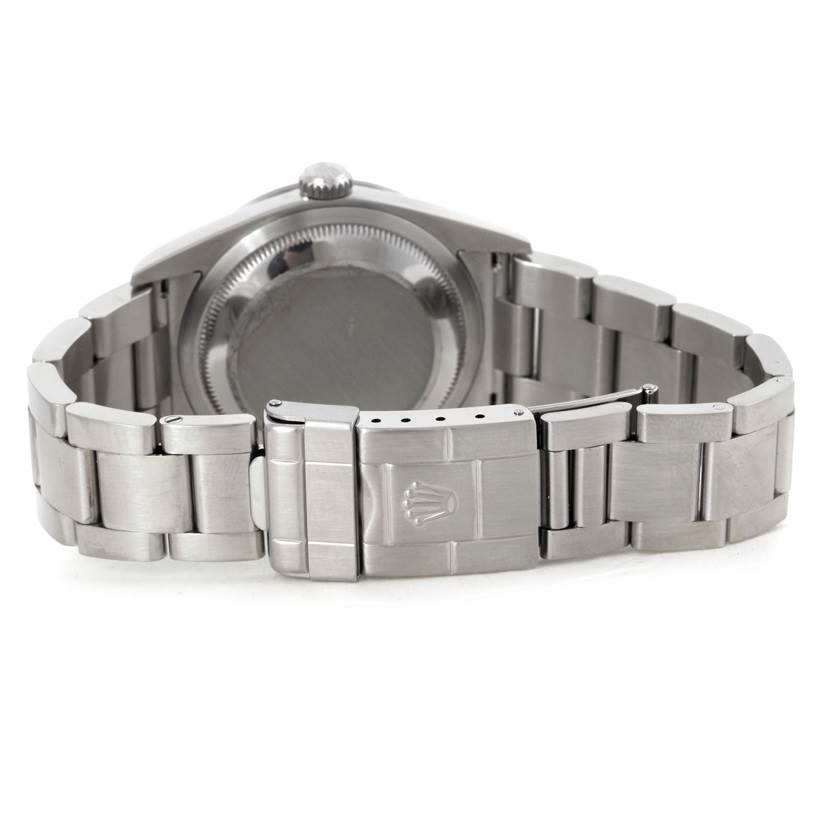 The image shows the back case and bracelet of a Rolex Explorer 114270 Men's Stainless Steel Black Dial 114270 Men's Stainless Steel Black Dial watch, showcasing the clasp and the Oyster bracelet.