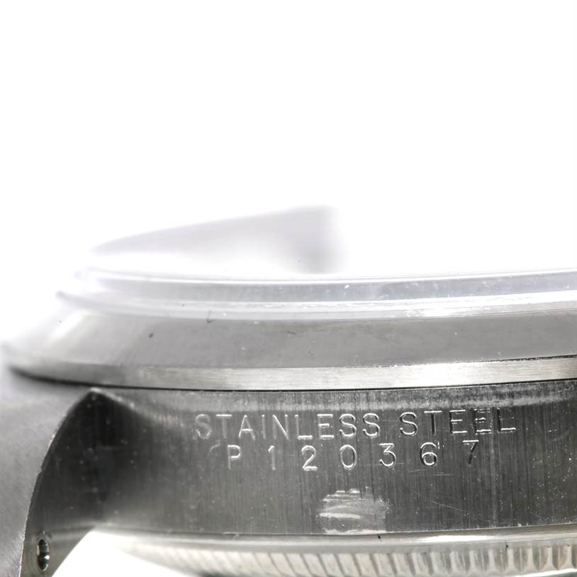 This image shows a close-up of the side of the casing for a Rolex Explorer 14270 Men's Stainless Steel Black Dial 14270 Men's Stainless Steel Black Dial model, highlighting the stainless steel engraving and serial number.