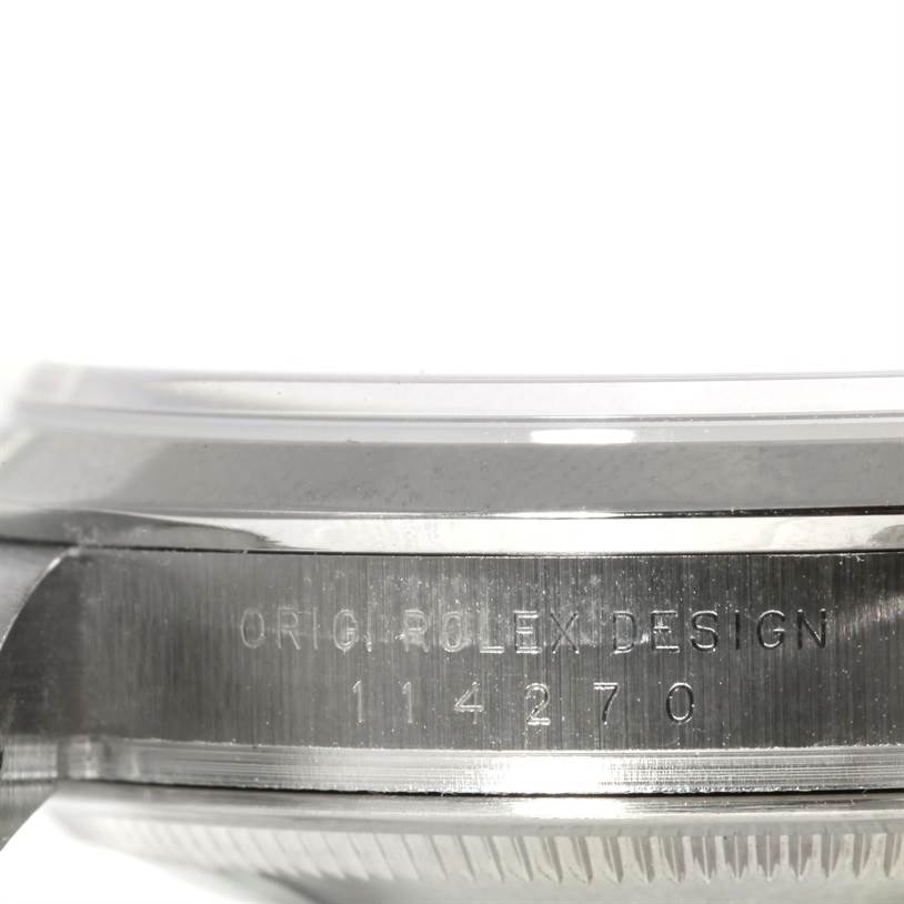 This image shows a close-up side view of the case side and bezel, displaying the "Orig Rolex Design" and model number of the Rolex Explorer 114270 Men's Stainless Steel Black Dial 114270 Men's Stainless Steel Black Dial.