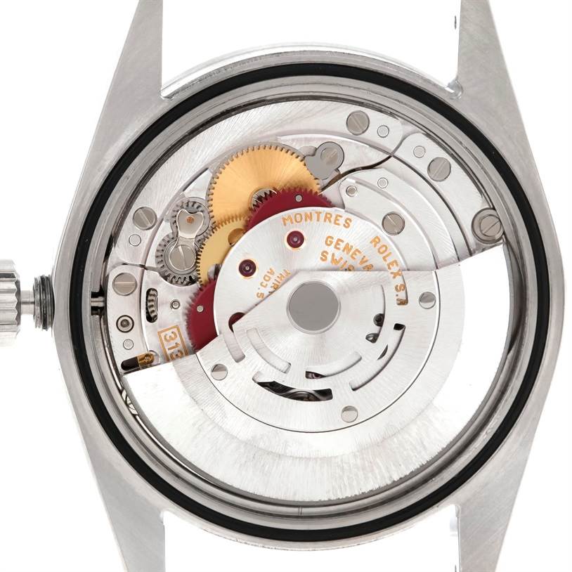 This image shows the internal mechanism and movement of the Rolex Explorer 114270 Men
s Stainless Steel Black Dial 114270 Men
s Stainless Steel Black Dial model from a rear angle with the case back removed.