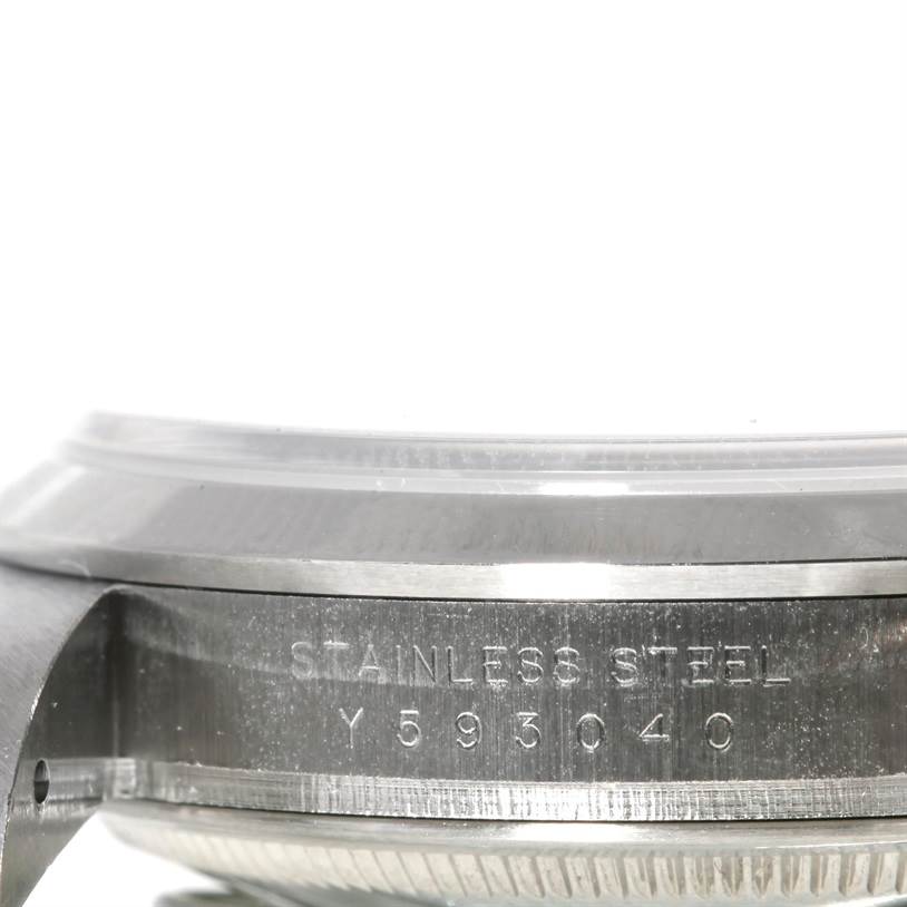 This image shows a close-up side view of the Rolex Explorer 114270 Men
s Stainless Steel Black Dial 114270 Men
s Stainless Steel Black Dial watch, highlighting the stainless steel case and serial number.