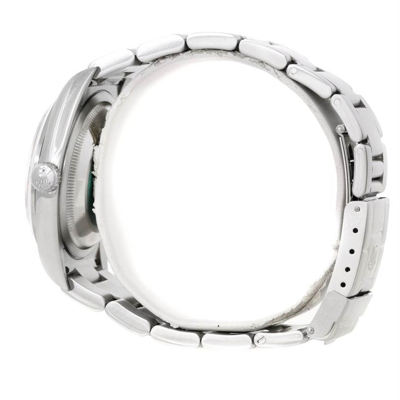 The image shows a side view of the Rolex Explorer 114270 Men
s Stainless Steel Black Dial 114270 Men
s Stainless Steel Black Dial model, highlighting the bracelet and the side of the case with the crown.