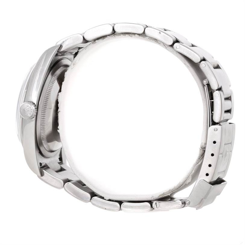 This side view of the Rolex Explorer 114270 Men's Stainless Steel Black Dial 114270 Men's Stainless Steel Black Dial watch shows its crown, case, and a partially open bracelet.