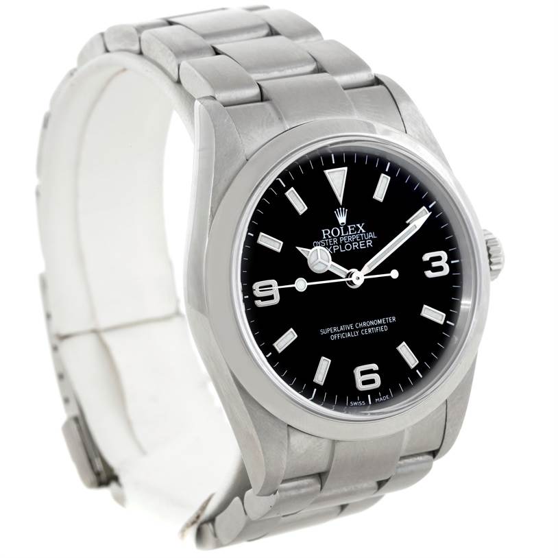The Rolex Explorer 114270 Men's Stainless Steel Black Dial 114270 Men's Stainless Steel Black Dial model watch is shown at a three-quarter angle, highlighting its black dial, silver hands, and metal band.