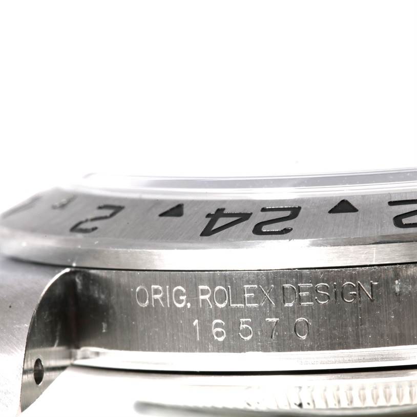 The image shows a close-up angle of the side of a Rolex Explorer 16570 Men's Stainless Steel Black Dial 16570 Men's Stainless Steel Black Dial watch, highlighting the bezel and engraved model number "16570."