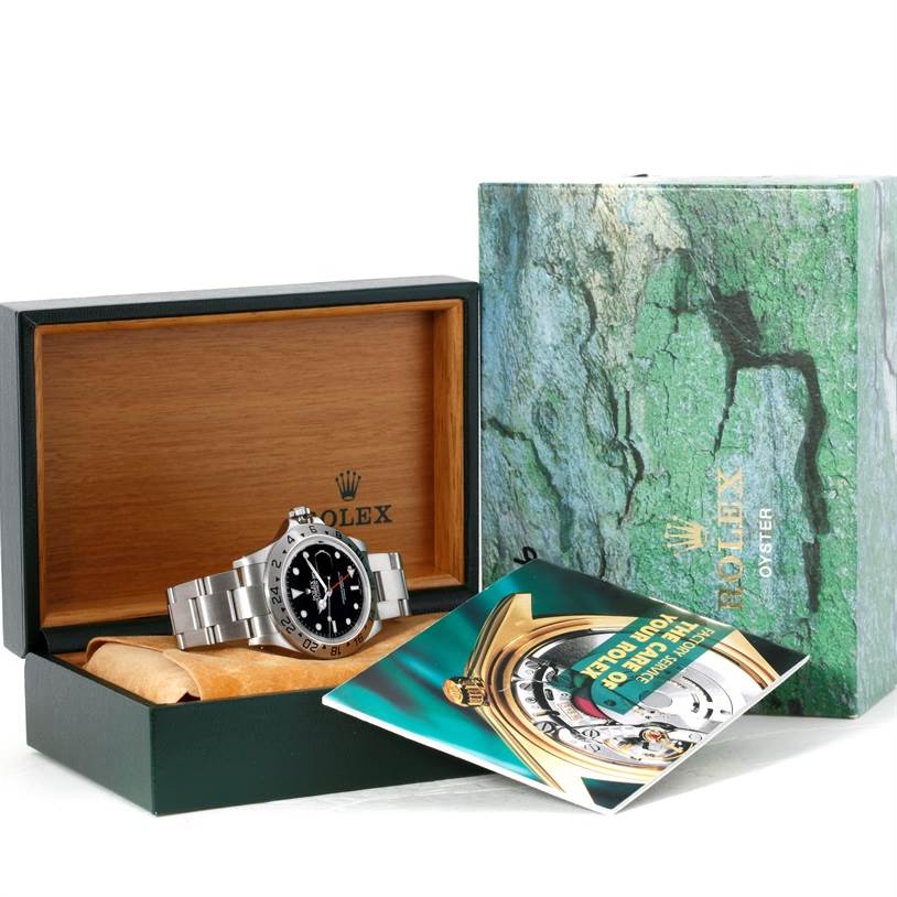 This image shows a Rolex Explorer 16570 Men's Stainless Steel Black Dial 16570 Men's Stainless Steel Black Dial watch in its open box with a booklet and outer Rolex packaging visible.