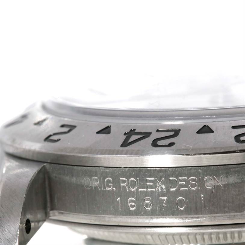 The image shows a close-up side view of a Rolex Explorer 16570 Men's Stainless Steel White Dial 16570 Men's Stainless Steel White Dial watch, highlighting the bezel and engraved model number "16570."