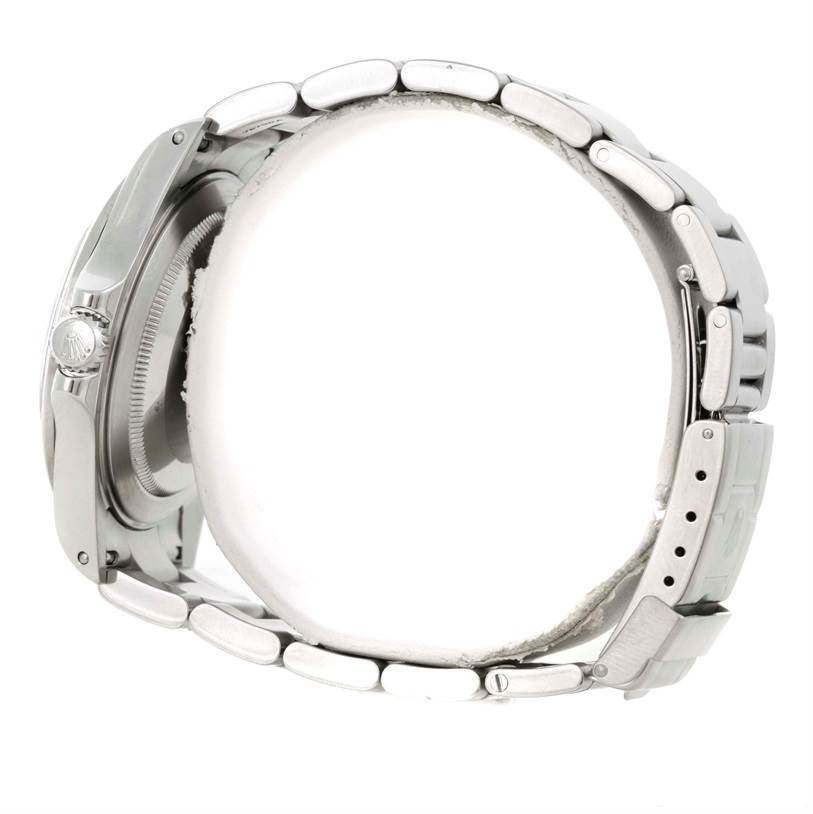 The image shows a side view of a Rolex Explorer 16570 Men's Stainless Steel White Dial 16570 Men's Stainless Steel White Dial watch, highlighting its case, bracelet, and clasp.