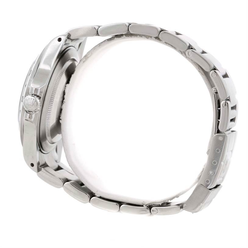 This image shows a side view of the Rolex Explorer 16570 Men's Stainless Steel White Dial 16570 Men's Stainless Steel White Dial watch, highlighting the case, crown, and metal bracelet.