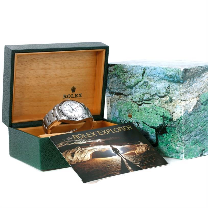 The Rolex Explorer 16570 Men's Stainless Steel White Dial 16570 Men's Stainless Steel White Dial watch is shown at an angle inside its open box, with the box lid and booklet visible.