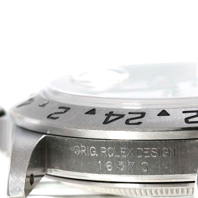 A close-up side view of the Rolex Explorer 16570 Men's Stainless Steel Black Dial 16570 Men's Stainless Steel Black Dial watch, showing the bezel and engraved case.