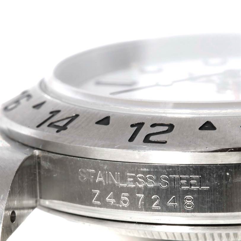 The image shows a side angle of the stainless steel case and bezel with engraved numerals on the Rolex Explorer 16570 Men's Stainless Steel White Dial 16570 Men's Stainless Steel White Dial watch.