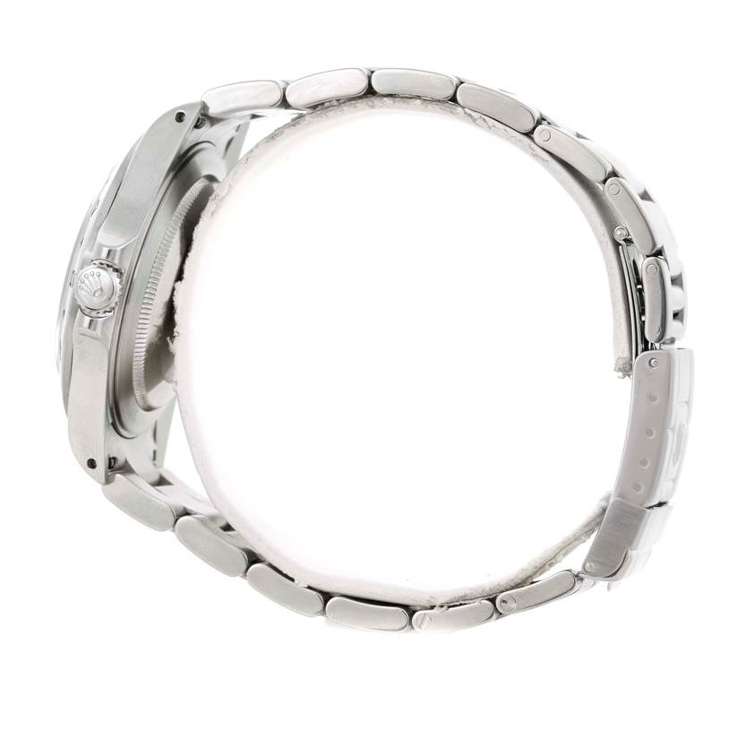 The image shows a side view of a Rolex Explorer 16570 Men's Stainless Steel White Dial 16570 Men's Stainless Steel White Dial watch, highlighting its crown, case, and metal bracelet.