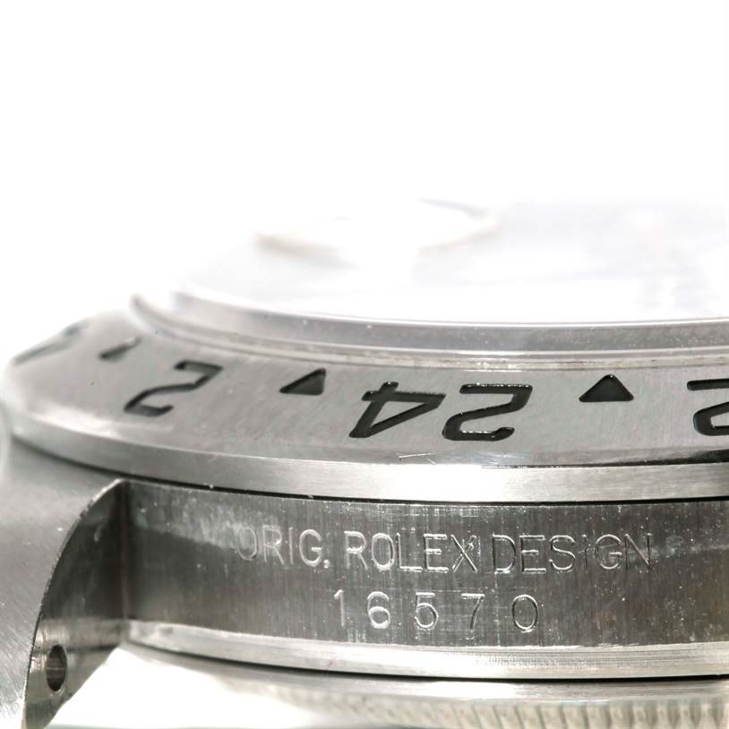 The image shows a close-up angle of the side and bezel of the Rolex Explorer 16570 Men's Stainless Steel White Dial 16570 Men's Stainless Steel White Dial, emphasizing the engraved model number 16570.