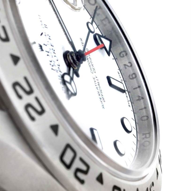 The image shows a close-up of the dial and bezel of a Rolex Explorer 16570 Men's Stainless Steel White Dial 16570 Men's Stainless Steel White Dial watch.