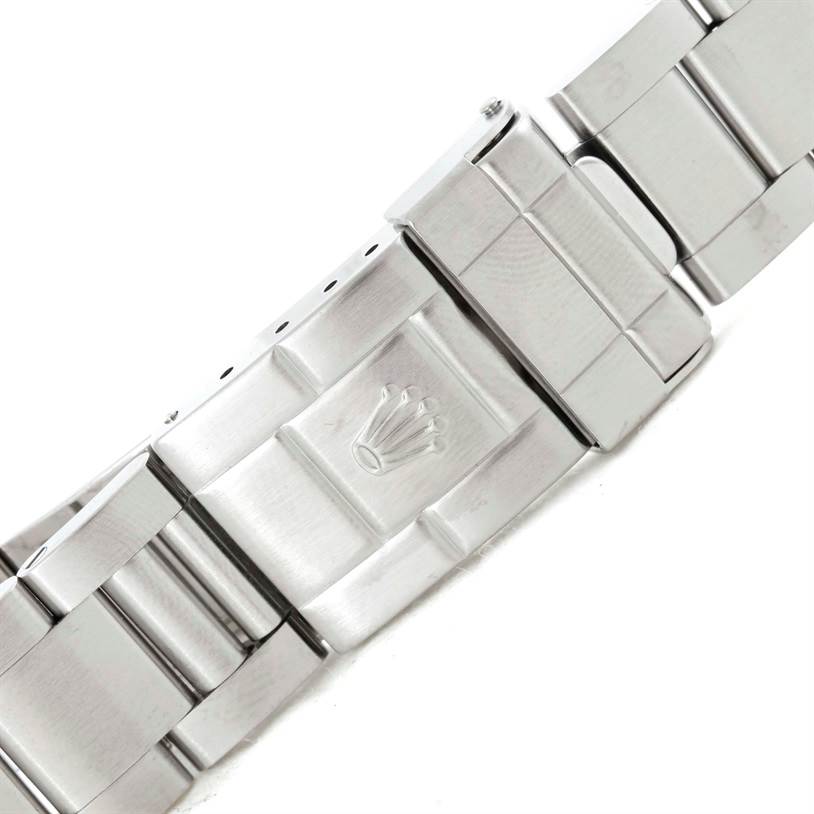 This image shows a close-up of the metal clasp of a Rolex Explorer 16570 Men's Stainless Steel White Dial 16570 Men's Stainless Steel White Dial watch band.