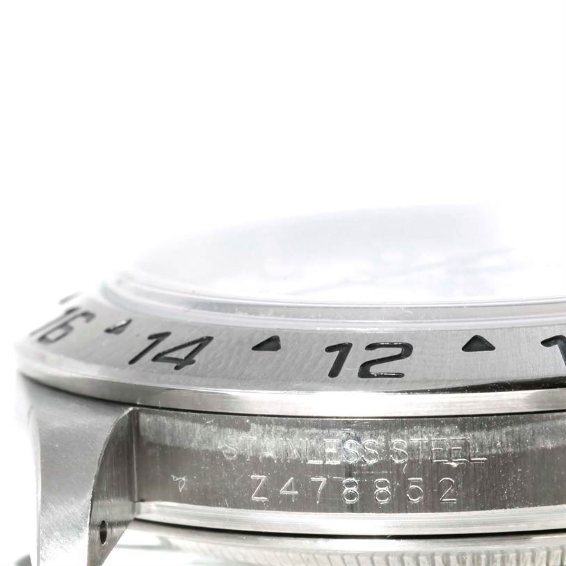 A close-up angle of the Rolex Explorer 16570 Men's Stainless Steel White Dial 16570 Men's Stainless Steel White Dial watch, showing the side case, part of the bezel with numbers, and serial number engraving.