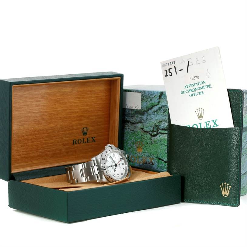 The image shows a Rolex Explorer 16570 Men's Stainless Steel White Dial 16570 Men's Stainless Steel White Dial watch with its box, warranty card, and green pouch.
