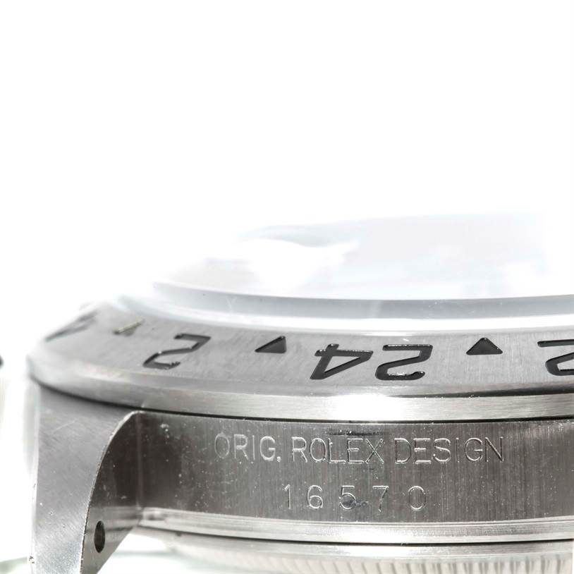 This image shows a close-up side view of the Rolex Explorer 16570 Men's Stainless Steel White Dial 16570 Men's Stainless Steel White Dial, highlighting the engraved bezel and the model number 16570.
