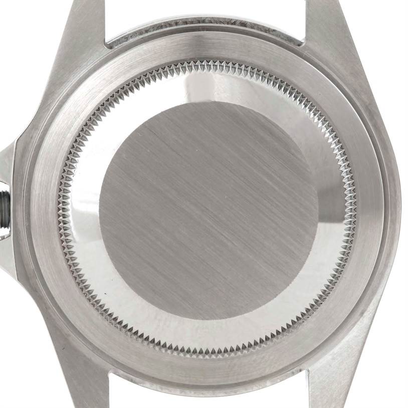 The image shows the back case of a Rolex Explorer 16570 Men's Stainless Steel White Dial 16570 Men's Stainless Steel White Dial watch viewed from the top angle.