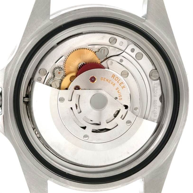 The image shows the back view of a Rolex Explorer 16570 Men's Stainless Steel White Dial 16570 Men's Stainless Steel White Dial watch, highlighting its internal mechanism and gears.