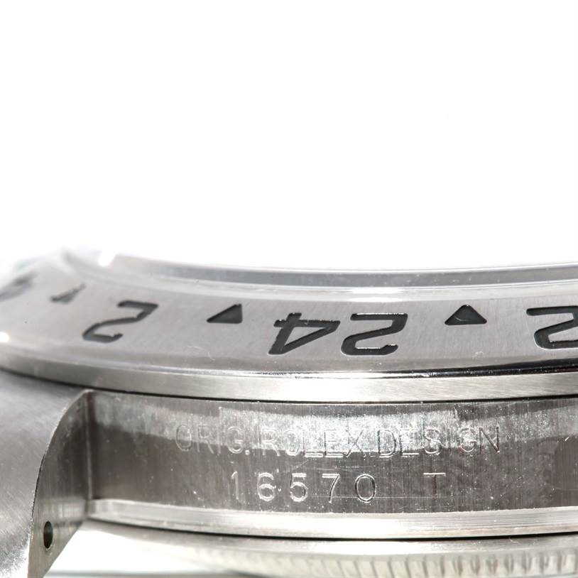 The image shows a close-up side view of the bezel and case side of the Rolex Explorer 16570 Men's Stainless Steel White Dial 16570 Men's Stainless Steel White Dial watch, revealing the model number 16570.