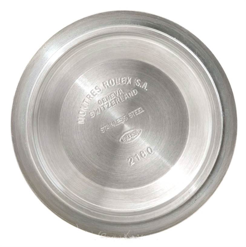 The image shows the inside case back of a Rolex Explorer 16570 Men's Stainless Steel White Dial 16570 Men's Stainless Steel White Dial watch, engraved with brand details and model information.