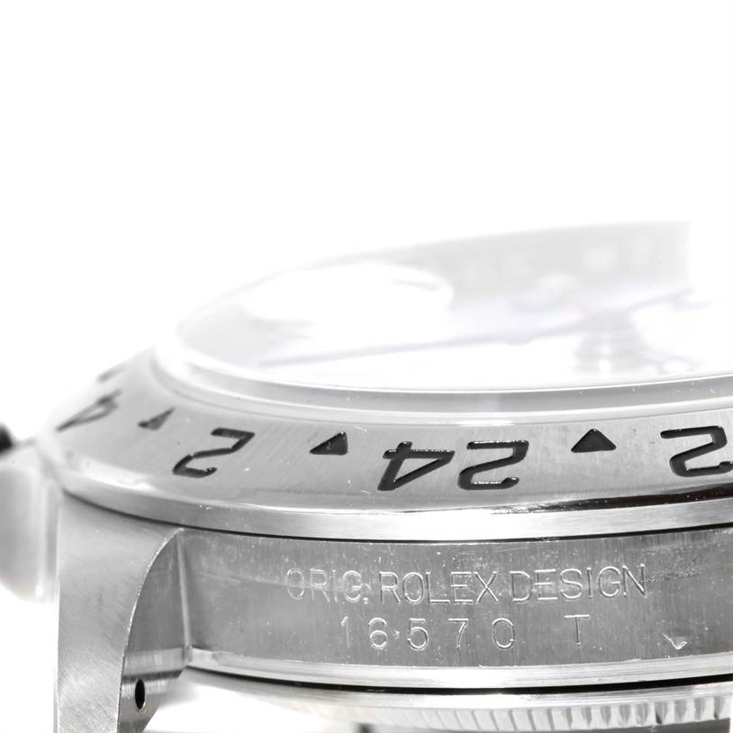 The image shows a close-up of the Rolex Explorer 16570 Men's Stainless Steel White Dial 16570 Men's Stainless Steel White Dial watch bezel and case, displaying the model number "16570."