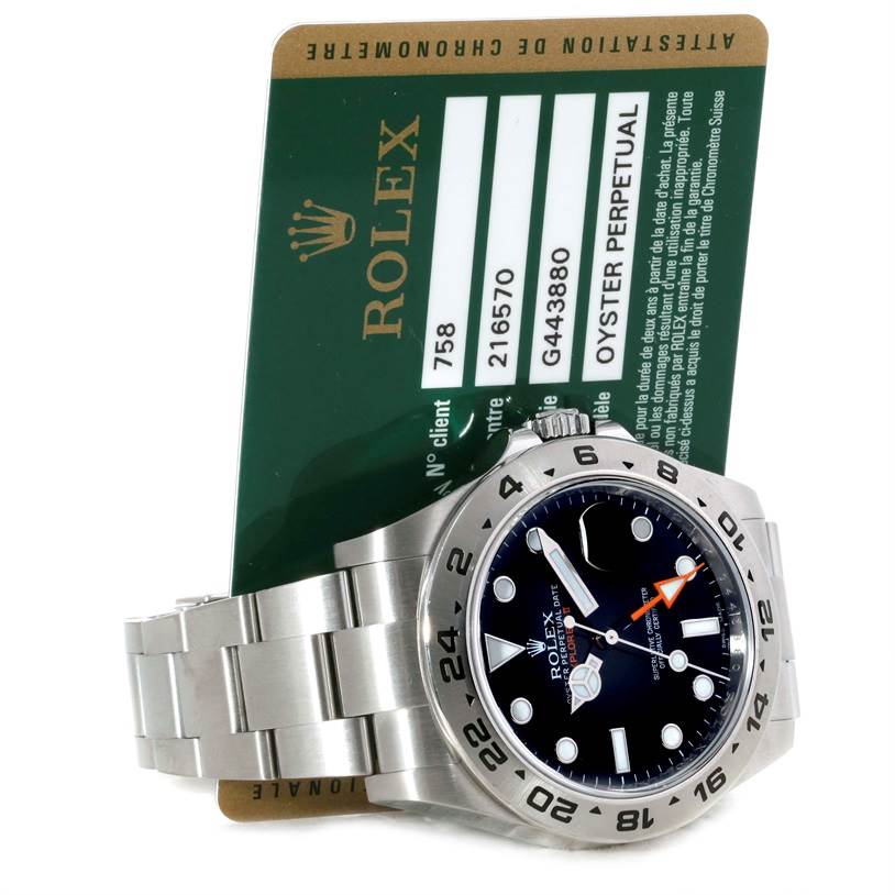 The image shows a Rolex Explorer 216570 Men's Stainless Steel Black Dial 216570 Men's Stainless Steel Black Dial watch, model 216570, focusing on the dial, bezel, and bracelet, accompanied by a certification card.