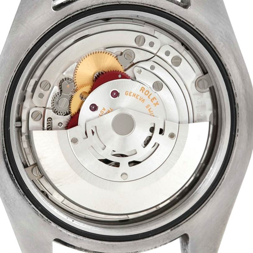 This image shows the intricate internal mechanism of a Rolex Explorer 216570 Men's Stainless Steel Black Dial 216570 Men's Stainless Steel Black Dial watch from a rear angle with the case back removed.