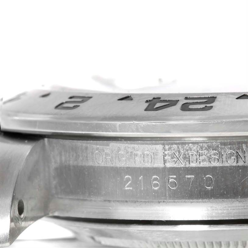 The image shows a close-up of the side case and bezel of a Rolex Explorer 216570 Men's Stainless Steel Black Dial 216570 Men's Stainless Steel Black Dial watch, with visible model number engraving.