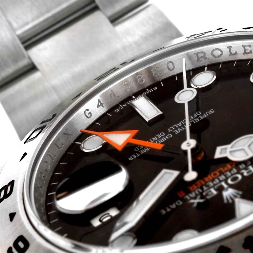 This close-up angle of the Rolex Explorer 216570 Men's Stainless Steel Black Dial 216570 Men's Stainless Steel Black Dial watch shows part of the bezel, dial with markers, and bracelet.