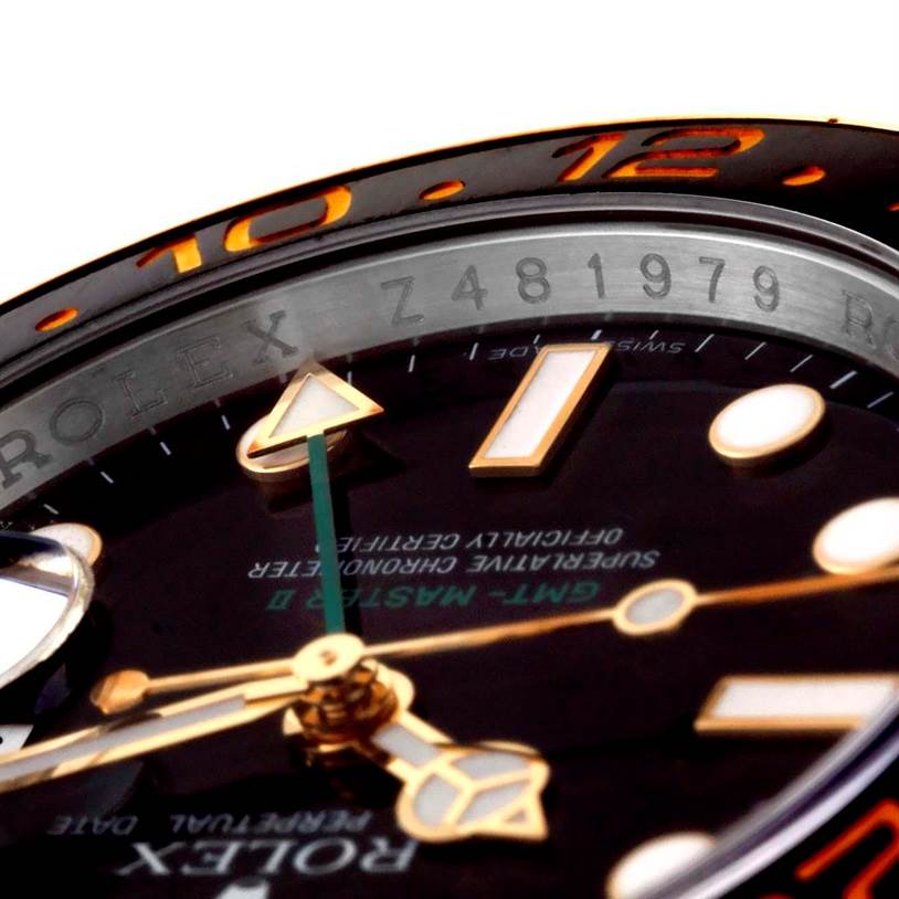 Close-up view of the Rolex GMT-Master 116713 Men's Stainless Steel Black Dial 116713 Men's Stainless Steel Black Dial watch showing the dial, hands, indices, date magnifier, and part of the bezel.
