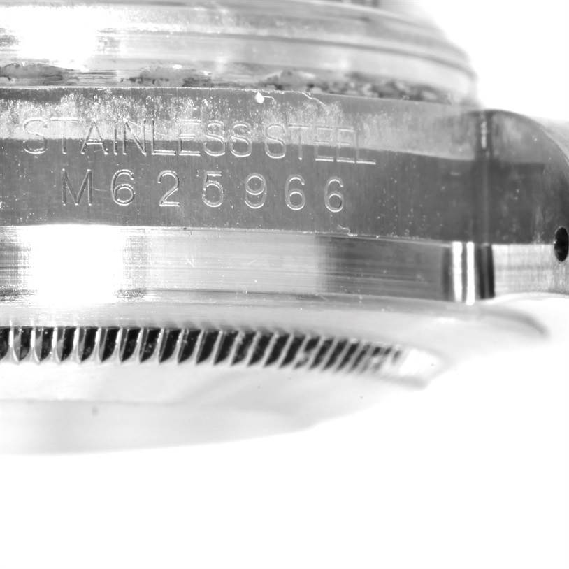 This close-up image shows the side of a stainless steel Rolex GMT-Master 116710BKSO Men's Stainless Steel Black Dial 116710BKSO Men's Stainless Steel Black Dial watch, displaying its case and serial number "M625966".